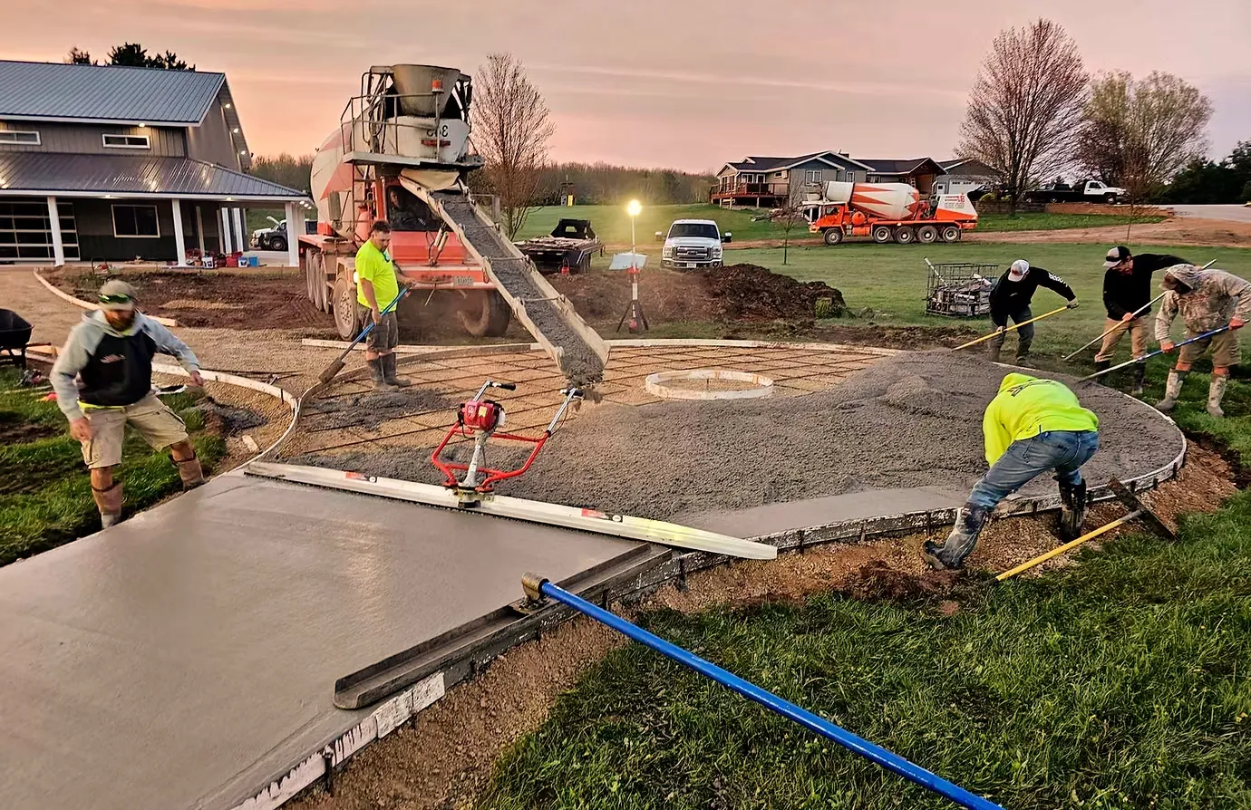 Advance Concrete workers pouring a residential fire ring (1)